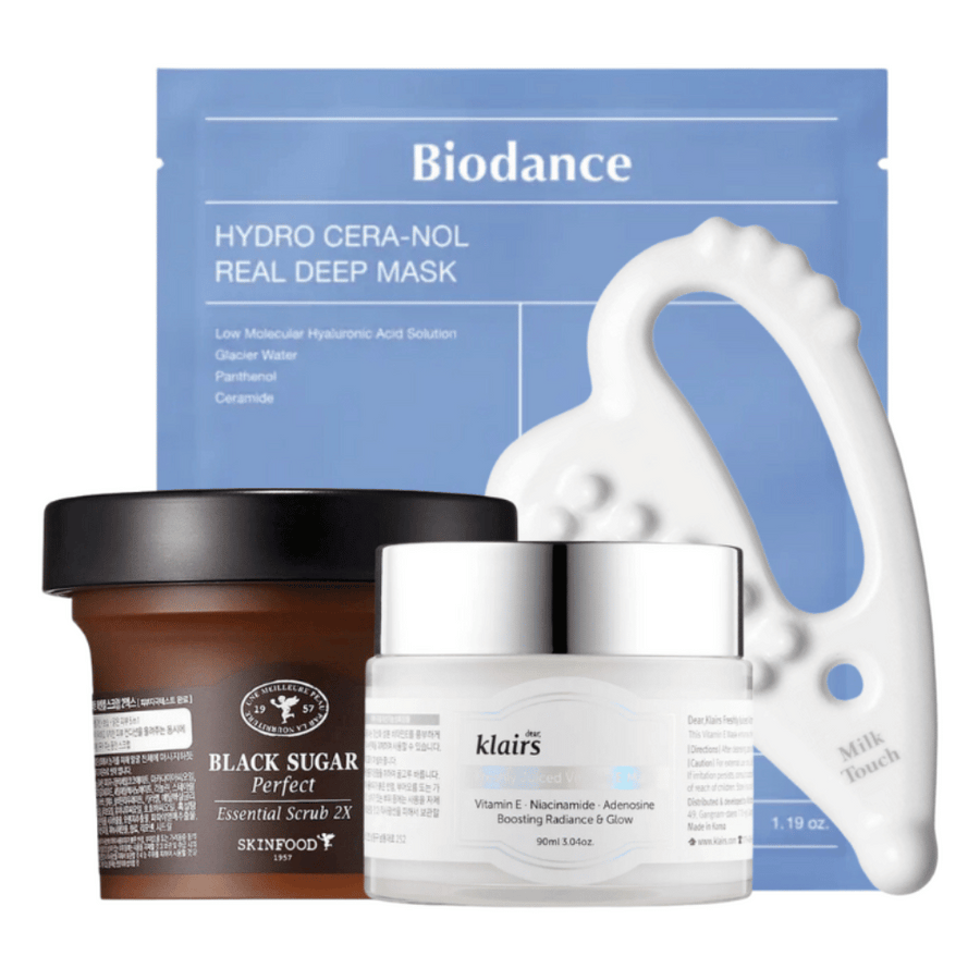 Bilden visar ett urval av hudvårdsprodukter, inklusive en ansiktsmask från Biodance, en burk med Black Sugar Perfect Essential Scrub 2X från Skinfood, en kräm från Dear, Klairs, och ett vitt verktyg för ansiktsmassage från Milk Touch.